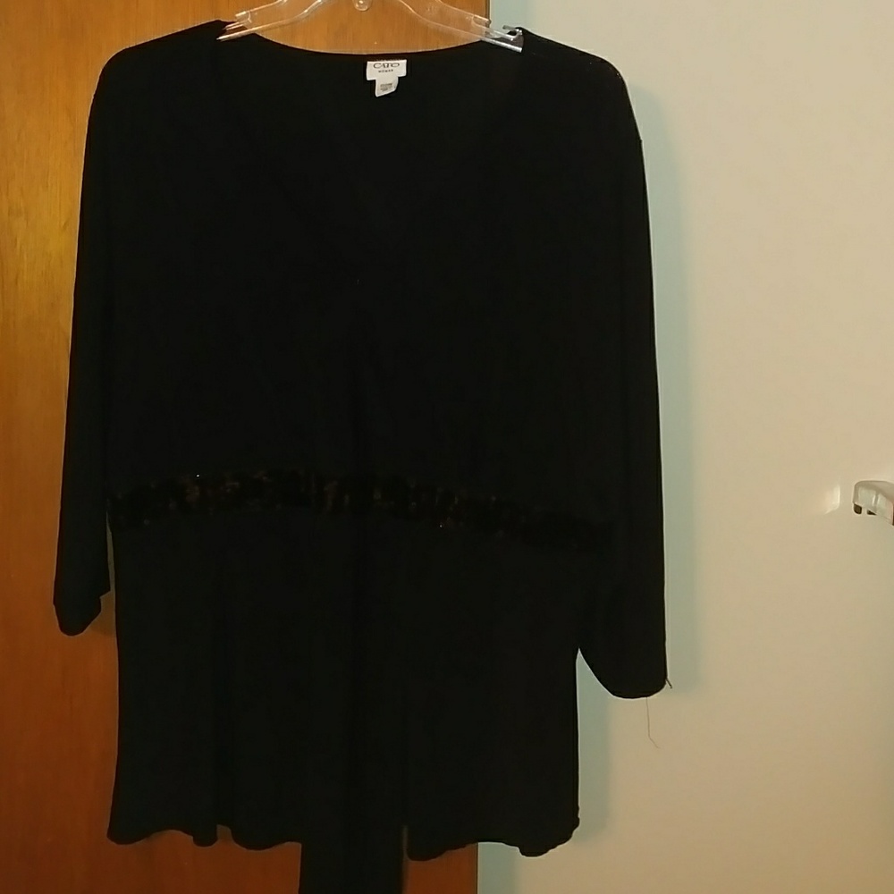 SOLD. . Black mock wrap blouse with sequined trim